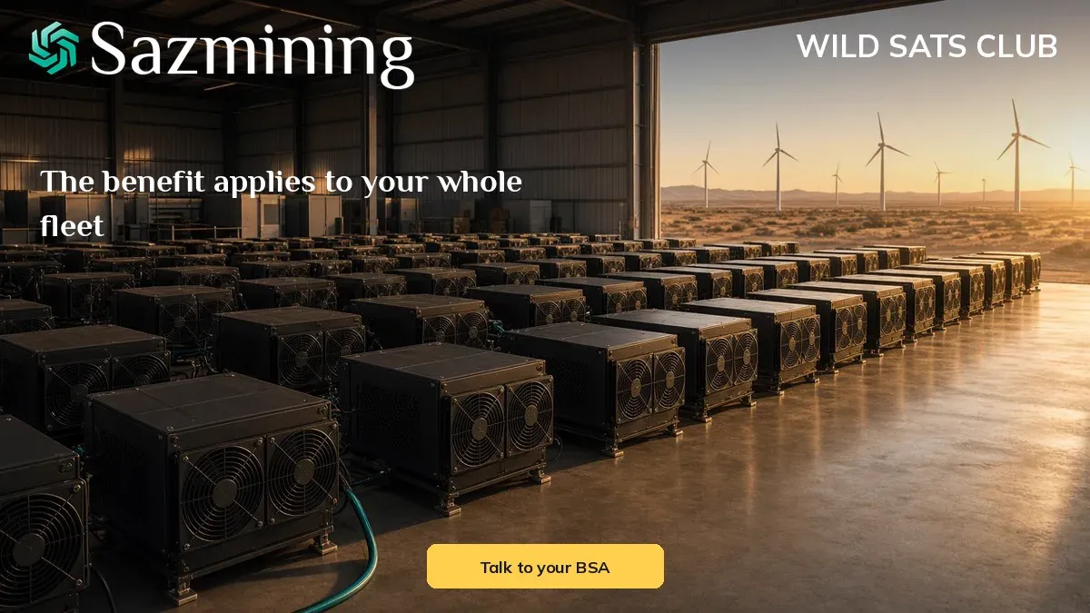 Rows of air-cooled Bitcoin mining rigs inside a hall that opens onto a desert wind farm at golden hour